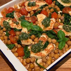 A picture of Halloumi with pesto, balsamic tomatoes, spinach and chickpeas.