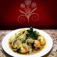 A picture of Egg Korma with curry leaves.