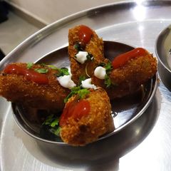 A picture of Poha Cutlet with Cheese.