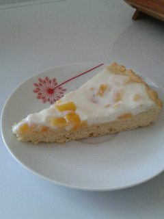 Una foto de Kuchen de duraznos