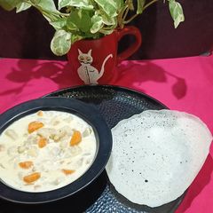 A picture of Appam And Veg Stew.
