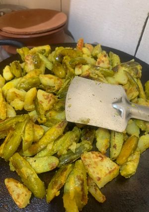 A picture of Crispy Aloo Kundri Tawa Fry (Potato and Ivy gourd).