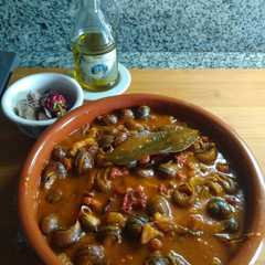 Una foto de Caracoles en salsa