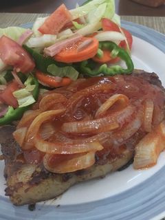 Una foto de Chuleta encebollada