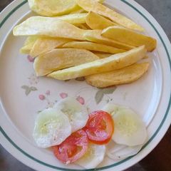 A picture of Chips and cucumber salad.