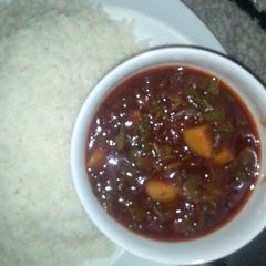 A picture of Steamed rice grits with vegetable sauce.