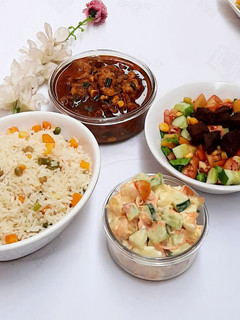 A picture of Fried veg white rice with shredded chicken soup.