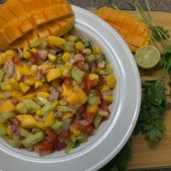 A picture of Mango fusion salad🥭🥒🌽🍅🧅🍋.