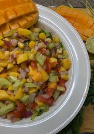 A picture of Mango fusion salad🥭🥒🌽🍅🧅🍋.