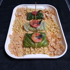 A picture of Potato Soyabean Stuffed Cabbage Parcel.