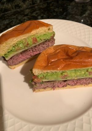 A picture of Guacamole cheeseburger 🍔.