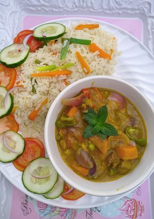 A picture of Coconut rice and lamb curry.