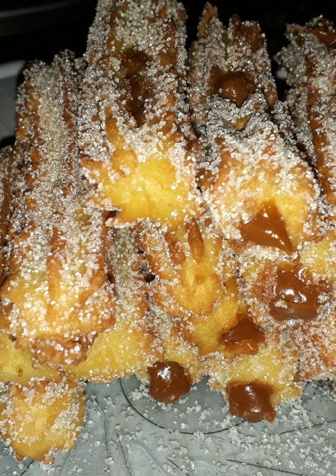 Una foto de Churros con chocolate