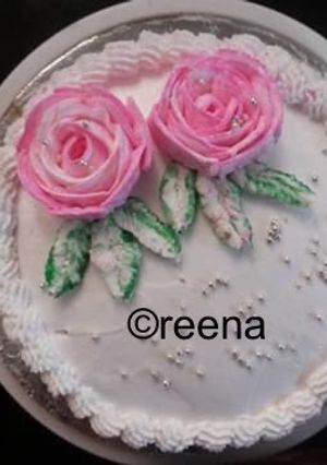 A picture of Simple homemade and decorated eggless vanilla cake.