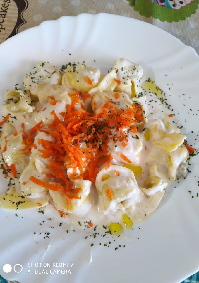 Una foto de Tortellinis de ricota y espinacas con nata