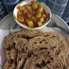 A picture of Aloo tomato with parantha.