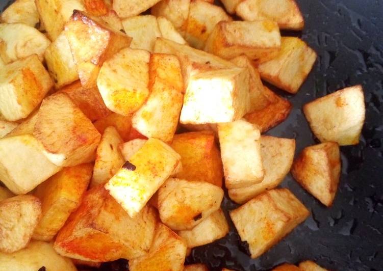 Shallow fried egg yellow color potatoes