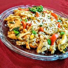 A picture of Vegetable pasta in red sauce.
