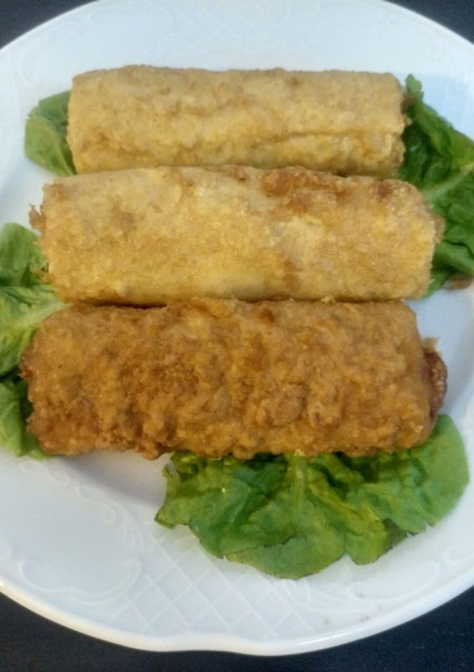 Una foto de Rollitos de pasta con jamón york y queso y curry