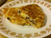 A picture of quesadilla with beans