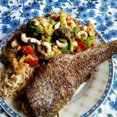 A picture of Thai chicken and fish vegetable stir fry.