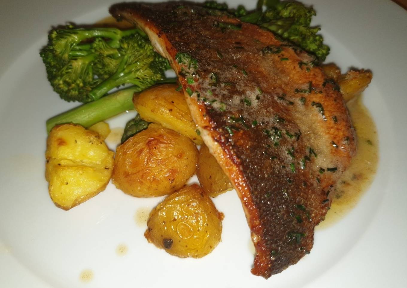 Sea Bass, Crispy Potatoes, Greens & a Brown Butter Chive Sauce