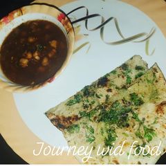 Amritsari stuffed kulcha choley A picture of Amritsari stuffed kulcha choley.