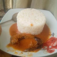 A picture of Rice and tomato stew.