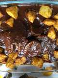 Redondo con salsa negra (Asado negro)