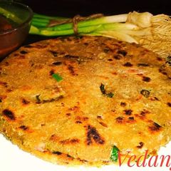 A picture of Jowar Roti with Green Garlic.