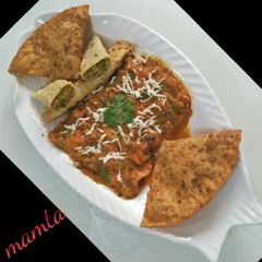 Veg patiala (veg-paneer stuffed papad roll with gravy.) A picture of Veg patiala (veg-paneer stuffed papad roll with gravy.).