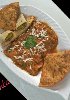 A picture of Veg patiala (veg-paneer stuffed papad roll with gravy.).
