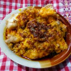A picture of Beans and yam pudding with onion sauce.