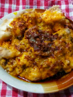 A picture of Beans and yam pudding with onion sauce.