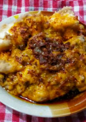 A picture of Beans and yam pudding with onion sauce.