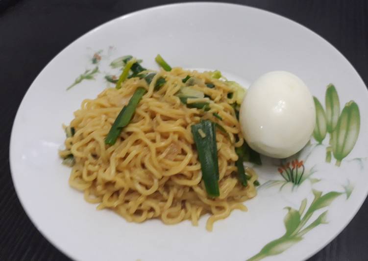 My Daughter love Indomine with spring onion and boiled egg