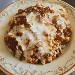 A picture of Beef and chickpea rogan josh with rice and yoghurt.