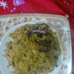 A picture of Jollof rice wit curry leaf.