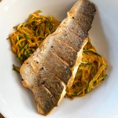 A picture of Courgetti Branzino - seabass with zoodles.