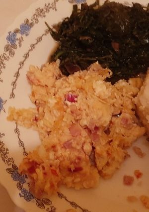 A picture of Ugali, Scrambled Eggs and Greens.