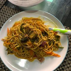A picture of Spagetti with veggies.