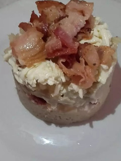 Una foto de Timbal de cayeye con queso y tocino