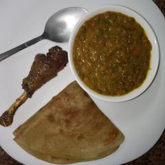 A picture of Lentils sauce, banana chapati and sweet and sour glazed chicken.