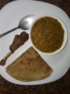 A picture of Lentils sauce, banana chapati and sweet and sour glazed chicken.