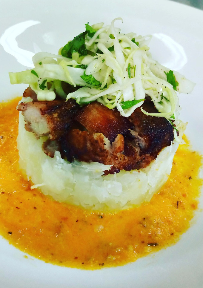 Una foto de Yuca con Chicharrón