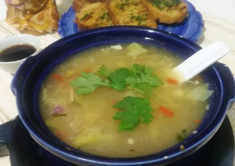 Chicken soup with garlic bread