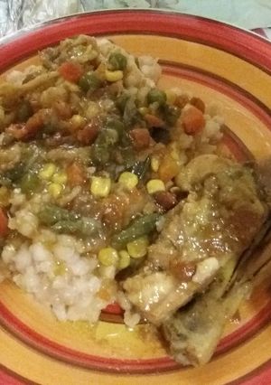 A picture of Chicken stew with mix veggies.