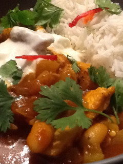 A picture of Yellow chicken curry.
