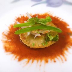 A picture of Eggless ravioli with Tabasco Sauce.