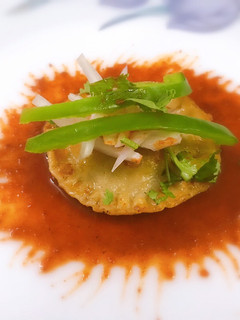 A picture of Eggless ravioli with Tabasco Sauce.
